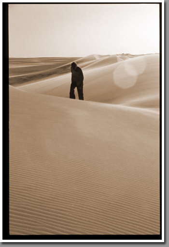 Raymond Bird conquering dunes near Jebel Arkenu